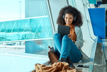 Image showing Airport, travel and black woman with tablet by window waiting for flight, departure and transport. Immigration, lobby and girl with headphones on digital tech for internet, music and social media