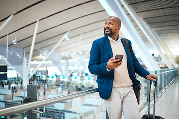 Image showing Black man waiting in airport with phone, smile and luggage in terminal for business trip. Technology, travel and happy businessman with international destination checking flight schedule app online.