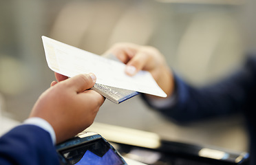 Image showing Ticket, airport and person with passport at counter for travel documentation, security ID and airplane journey. Hands, passenger and identity document for check in, booking and flight transportation