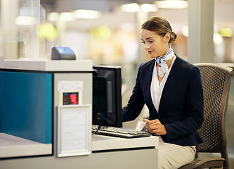 Image showing Airport, check in desk and woman on computer for security, travel agent or transport management. Airplane concierge, customer service and ticket help of global booking, journey or flight receptionist