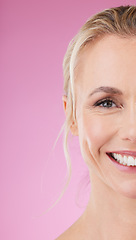 Image showing Beauty, skincare and half portrait of woman with smile, glowing skin and natural spa makeup in studio. Mockup, advertising and luxury cosmetics, face of happy mature model isolated on pink background