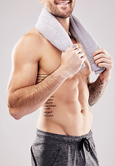 Image showing Body, man and abdomen, fitness with beauty and grooming, hygiene with health and clean on studio background. Happy, topless male with towel and cosmetics with bodybuilder, exercise and stomach muscle