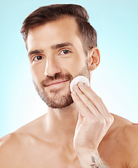 Image showing Happy, skincare and cotton with portrait of man for toner, makeup remover and hydration cosmetics. Facial, wellness and spa treatment with model and cleaning face for self care, glow and dermatology