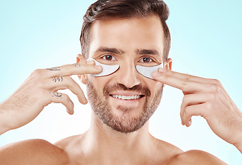 Image showing Eye patch beauty, man and treatment portrait with smile and product for eyes in isolated studio. Skincare, spa wellness and facial for model face with cosmetics, dermatology and detox with collagen