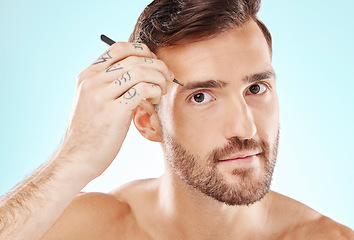 Image showing Beauty, eyebrows and tweezers with face of man for grooming, hygiene and hair removal. Cosmetology, treatment and facial growth with model and tool for morning routine, trimming and cleaning