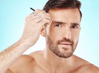 Image showing Grooming, eyebrows and tweezers with face of man for beauty, hygiene and hair removal. Cosmetology, treatment and facial growth with model and tool for morning routine, trimming and cleaning