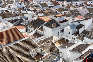 Image showing Aerial panoramic view of rooftops of white houses of Olvera town, considered the gate of white towns route in the province of Cadiz, Spain