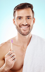 Image showing Smile, portrait or man brushing teeth with dental toothpaste for healthy oral hygiene grooming in studio. Eco friendly, smile or happy male model cleaning mouth with a natural bamboo wood toothbrush