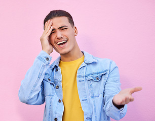 Image showing Confused, portrait and man with a headache pain isolated on a pink background in a studio. Mental health, tired and sad person with a question, frustrated and stress from a poblem on a backdrop
