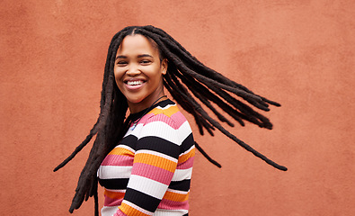 Image showing Playful, fun and portrait of a black woman with a smile isolated on a studio background. Happy, laughing and a funny young African girl with dreadlocks, happiness and expression on a backdrop