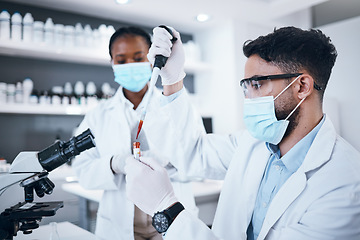 Image showing Science, blood and team with vial in laboratory for scientific research, dna testing or exam. Healthcare, medicine and scientists with pipette for liquid sample, rna results and medical analytics
