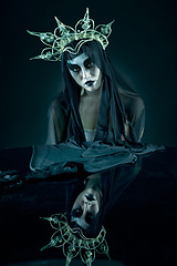 Image showing Evil, dark and fantasy with portrait of queen for makeup, fashion and horror art with reflection. Creative, fear and fabric veil with mystery woman and crown for spooky, elegant and nightmare