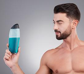 Image showing Skincare, beauty and shower gel with man and product with mockup for spa treatment, wellness and hygiene. Fresh, cosmetics and hydration with model holding bottle for health, grooming and cleaning