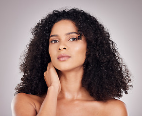 Image showing Hair, beauty and portrait of black woman for natural wellness, growth and shine on gray background. Salon aesthetic, face and serious girl with keratin treatment, curly hairstyle and luxury cosmetics