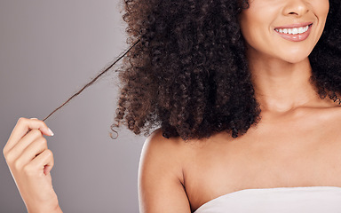 Image showing Hair in hands, beauty and face of black woman with smile for wellness, natural growth and curly style. Salon aesthetic, luxury cosmetics and happy girl holding strand for healthy keratin treatment