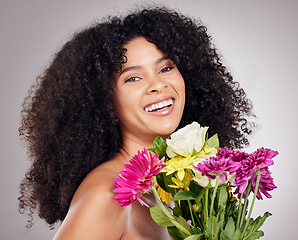 Image showing Skincare, portrait of black woman or sunflower in hair in studio for spring, luxury spa or sustainable. Aesthetic, beauty facial or girl face with plants for natural afro, cosmetics or eco friendly