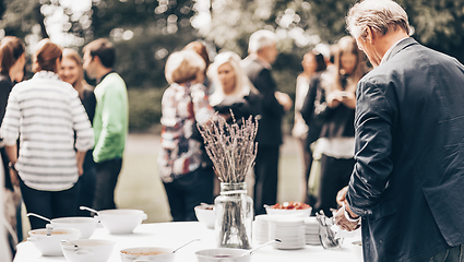 Image showing Banquet lunch break at conference meeting on hotel terrace.