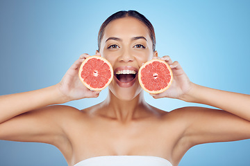 Image showing Grapefruit, skincare portrait and woman cosmetics on studio background for wellness benefits. Beauty model, diet and citrus fruits for natural detox, healthy nutrition and happy face with vitamin c