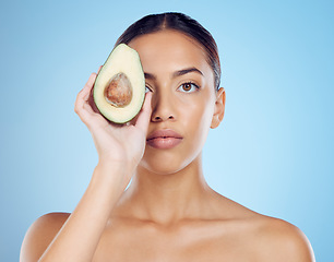 Image showing Avocado wellness, studio portrait and woman with healthy skincare for face, beauty and vegan makeup. Model, green fruits and natural cosmetics for detox, facial nutrition and aesthetic glow benefits