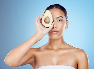 Image showing Avocado, studio portrait and woman with healthy skincare for wellness, face beauty and vegan makeup. Model, green fruits and natural cosmetics for detox, facial nutrition and aesthetic glow benefits