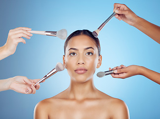 Image showing Cosmetic brush, model and portrait for wellness, beauty tools and face treatment. Cosmetics, makeup artist and application brushes for dermatology and woman products in a studio with blue background