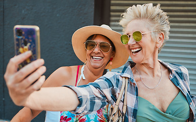 Image showing Happy, senior women and phone for selfie, profile picture or memory while bonding on summer vacation. Old people, friends and ladies laugh, pose and smile for fun while traveling together