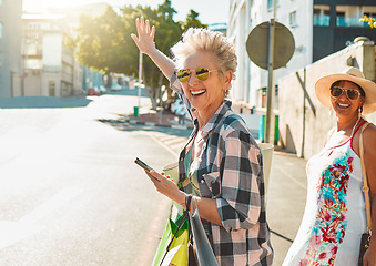 Image showing Friends, senior women and travel, adventure in city and happiness, freedom outdoor with smile. Happy, retirement and vacation in California, urban street and phone with fashion, sunglasses and mockup