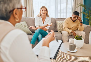Image showing Interracial couple, counseling and therapist with argument and fight on therapy sofa. Tired, relationship stress and marriage problem of people on couch feeling anxiety from divorce conversation