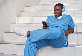 Image showing Doctor, phone and stairs for relaxing, communication or video call outside hospital for health advice. Happy black man nurse smiling in healthcare with smartphone and headset for telemedicine