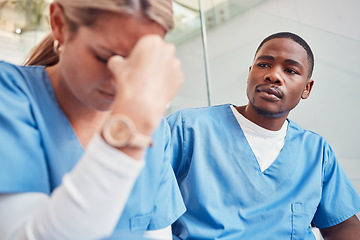 Image showing Healthcare, collaboration or loss and a sad nurse in the hospital with a man colleague showing compassion. Medical, death and insurance with a black male medicine professional consoling a friend