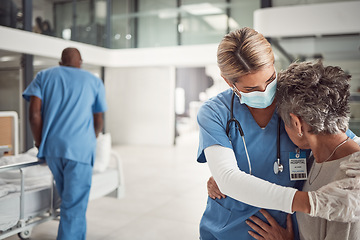 Image showing Doctor, hug and sad elderly woman in hospital for support, comfort and empathy for surgery of husband. Nurse, face mask and embrace wife of patient with covid 19 emergency in clinic with solidarity