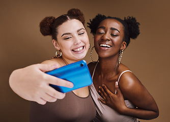 Image showing Fashion, selfie and friends smile with phone on brown background for wellness, cosmetics and makeup. Beauty influencers, happy and black women on smartphone for social media, picture and online post