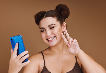 Image showing Selfie, peace sign and black woman with phone feeling excited, happy and beauty for profile picture. Social media, isolated and studio background with mockup of gen z, young and face of a model