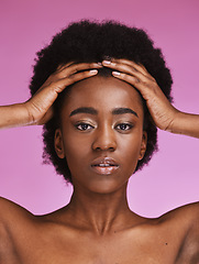 Image showing Black woman, portrait or touching afro hairstyle in relax beauty skincare, growth texture maintenance or salon wellness. Hands, hair or natural face makeup on studio model or isolated pink background