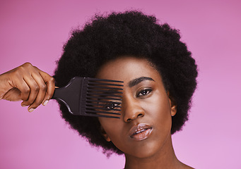 Image showing Portrait, hair or afro brush on beauty background in relax grooming routine, texture maintenance or growth wellness. Black woman, face or natural hairstyle comb with skincare makeup on isolated pink