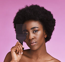 Image showing Portrait, black woman with comb and hair care with grooming, morning routine or studio background. Face, African American female or lady with cosmetics equipment, salon treatment or shine on backdrop