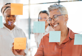 Image showing Planning, meeting or happy CEO writing a marketing strategy, advertising plan or branding ideas. Sticky notes, senior woman or manager working on a global startup project with creative employees