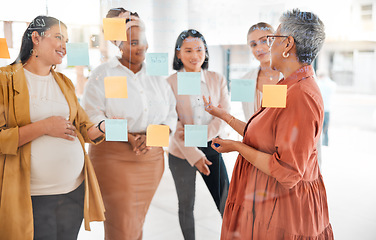 Image showing Senior woman in a business meeting for marketing strategy, advertising plan or branding ideas. Sticky notes, leadership or mature manager planning a global startup project with creative employees