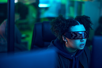 Image showing Computer hacker, cyberpunk and neon woman hacking software, online server or programming password phishing. Blue ransomware developer, cyber security glasses and night programmer coding malware code