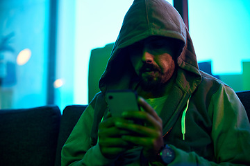 Image showing Phone, night hoodie or neon hacker hacking online database software, website server or man password phishing. Green ransomware developer, cybersecurity programming and programmer install malware code