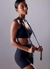 Image showing Fitness, jump rope and health with portrait of Indian woman for skipping, workout and cardio training. Strong, wellness and exercise with face of girl athlete for sports, motivation and gym goals