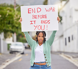 Image showing War protest, poster and city woman rally to stop Ukraine conflict, human rights support or global violence. Black student banner, street portrait or social justice warrior fight for government change