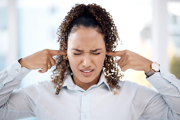 Image showing Noise, loud and woman closing her ears for the sounds in the office while working on a project. Annoyed, frustrated and upset professional female employee plug her fingers in her ear in the workplace