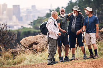 Image showing Hiking, support and hug with old men on mountain for fitness, trekking or adventure with city mockup. Motivation, discovery and travel with group of friends on trail for health, retirement or journey