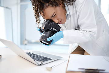 Image showing Black woman, forensic investigation and camera for laptop, it and cyber crime evidence on lab desk. Young technician, photography or computer for digital analysis of online criminal for cybersecurity