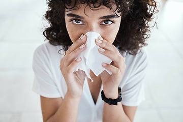 Image showing Black woman, tissue and blowing nose in home for portrait with allergies, sneeze and blurred background. Gen z girl, toilet paper and sick with allergy, covid and closeup in house, apartment or room