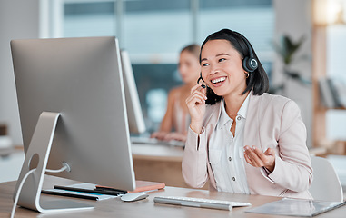 Image showing Asian woman, call center and computer in consultation for telemarketing, customer support or service at office desk. Happy female consultant smiling in contact us for desktop advice, help or sales