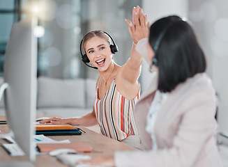 Image showing Woman, call center and high five for team telemarketing, winning or promotion in customer support or service at office. Happy female consultants celebrating sale, deal or achievement in contact us
