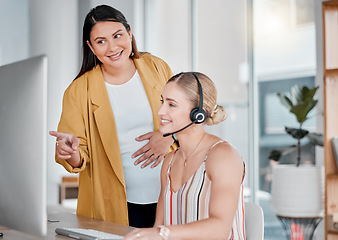 Image showing Call center, coaching and pointing at computer in office with pregnant woman, smile and learning at desk. Women, happy manager and desktop with tech support, customer service and workplace education
