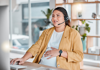 Image showing Office, stress and pregnancy, woman at desk with hand on stomach, exhausted in call center with headset. Burnout, pain and pregnant telemarketing consultant with anxiety from deadline time pressure.